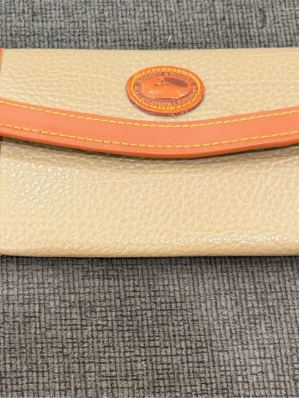 Dooney & Bourke Beige Leather Clutch with Orange Trim